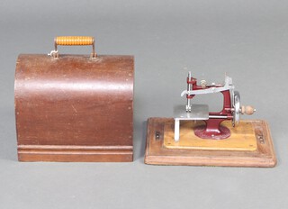 An Essex manual sewing machine complete with carrying case