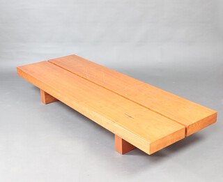 A rectangular beech finished bench/coffee table, raised on square tapered supports 81cm h (contact marks in places)