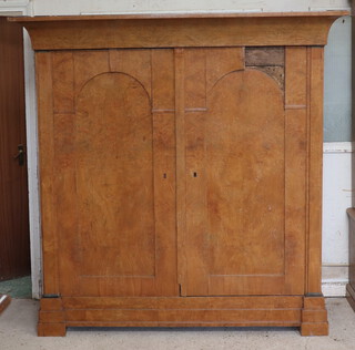 A 19th Century "Biedermiere" armoire with moulded cornice enclosed by arched panelled doors 190cm h x 191cm w x 69cm d (half built and in barn condition) 
