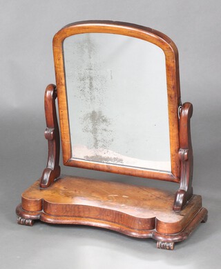 A Victorian arched plate dressing table mirror contained in a mahogany frame, the base of serpentine outline 62cm h x 57cm w x 24cm d 