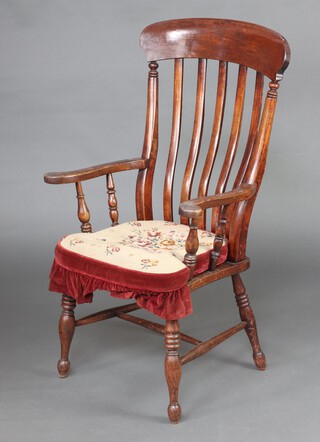 A 19th Century beech and elm stick and bar back Windsor carver chair, the seat marked H W, raised on turned supports with H framed stretcher 110cm h x 63cm w x 46cm d 