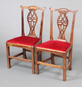 A pair of 18th Century Chippendale style oak slat back dining chairs with upholstered drop in seats, raised on square supports 97cm h x 52cm w x 41cm d (seat 24cm x 25cm) 