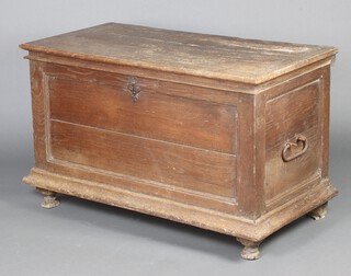 An 18th Century Continental oak coffer with hinged lid and original ring hinges and iron drop handles, raised on bun supports 74cm h x 122cm w x 64cm d 