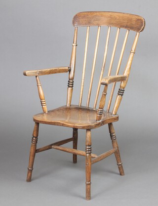 A 19th Century elm and beech stick back Windsor chair with solid seat, raised on turned supports with H framed stretcher, the back of the seat marked A.C.C., 103cm h x 60cm w x 40cm d (seat 26cm x 33cm) 