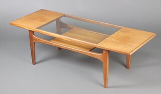 G-Plan, a mid-Century rectangular coffee table with plate glass panel to the centre above an undertier, raised on tapered supports 43cm h x 138cm l x 51cm d 