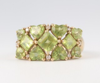 A yellow gold testing as 9ct peridot cluster ring 4.1 grams, size R 