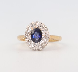 An 18ct yellow gold ring set an oval sapphire approx 0.5ct and 8 diamonds each approx. 0.02ct, 3 grams, size I 