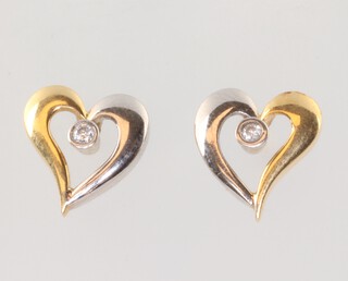 A pair of 2 colour gold (testing as 18ct) heart shaped ear studs with 2 x 0.05ct diamond 13mm, 3.8 grams