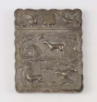 An Indian white metal repousse card case decorated with birds, animals and figures in a village landscape, 111 grams, 9.5cm 