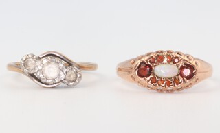 Two yellow gold (testing as 9ct) rings, 1 set with 3 paste stones, the other with an opal and garnets, 4.2 grams sizes L and O 