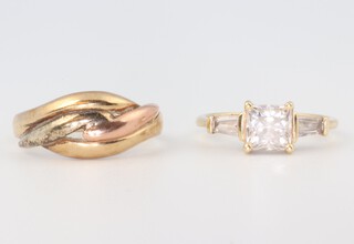 A 14ct yellow gold paste set ring 2.2 grams and a 9ct gold rope twist ring, 5.8 grams 3.5 grams  sizes M and P 