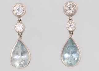 A pair of white gold (testing as 18ct) aquamarine and diamond ear studs, the 2 diamonds each 0.25ct, 20mm 