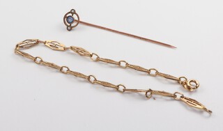 A 9ct yellow gold bracelet 17cm and a paste set tie pin, 3.2 grams 