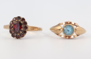 Two yellow gold (testing as 9ct) rings, one a garnet cluster the other paste, 4.1 grams, sizes S and L 