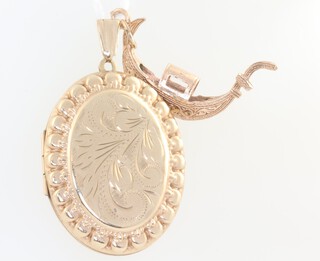 A 9ct yellow gold oval locket together with a ditto gondola charm 10.2 grams 