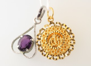 A yellow gold (testing as 22ct) pendant 4 grams, together with a silver pendant 