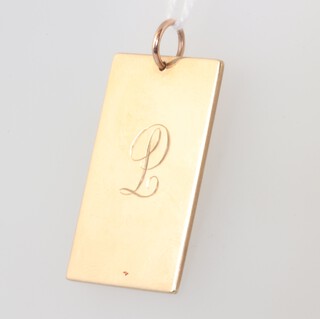 A yellow gold (testing as 9ct) engraved pendant 8.1 grams