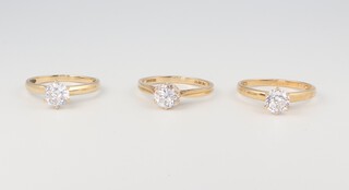 Three 9ct yellow gold paste set rings, 7 grams, size R 