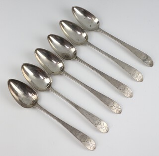 A set of 6 George III silver table spoons with bright cut decoration Dublin 1799, maker Samuel Neville, 456 grams 