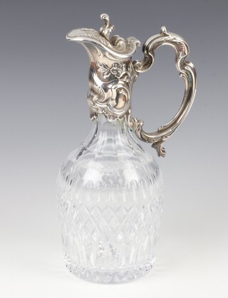 A cut glass ewer with silver plated Rococo mounts 28cm 