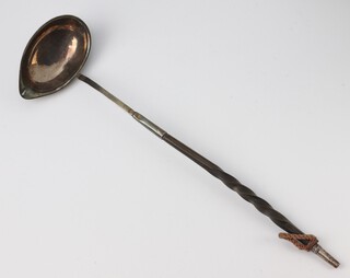 A Georgian white metal punch ladle with whale bone handle