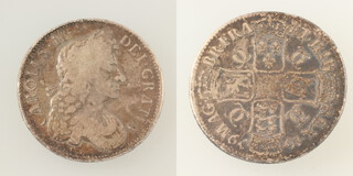 A Charles II (1660-1685), a silver crown (S 3358/3359) dated 1679 T. PRIMO 29.2 grams 