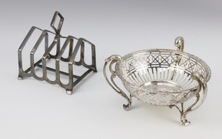 An Edwardian silver pierced dish with scroll handles Birmingham 1910, together with an Art Deco 5 bar toast rack Sheffield 1936, 198 grams 