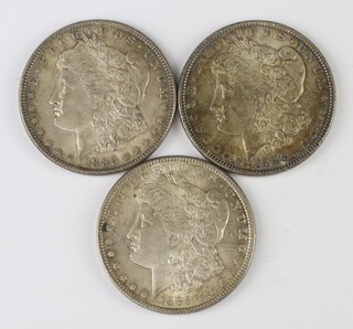 Three US silver Morgan dollars, 2 dated 1886 and 1 1885, weights 26.73g, 26.77g & 26.80g