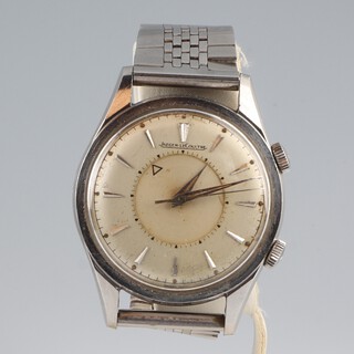 A gentleman's vintage steel cased Jaeger Le Coultre wristwatch with 2 tone dial and alarm function, contained in a 35mm case, the case marked E856 the movement marked 1466126, the back stamped 796541, in working order 