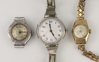 A lady's silver cased wristwatch on an expanding bracelet, a ditto with engraved case and a Lanco yellow gold cased wristwatch on a gilt bracelet (none are working) 