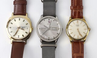 A gentleman's gilt cased Medana Vibrax wristwatch, a steel cased Rado day/date ditto and a Sekonda day/date ditto (none are working) 