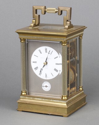 Mathew Norman, a 20th Century 8 day carriage alarm clock, the 6cm circular dial with Roman numerals contained in a gilt case with reeded columns to the side, the back plate marked Mathew Norman London 1750, contained in a gilt case 14cm h x 10cm w x 9cm d 