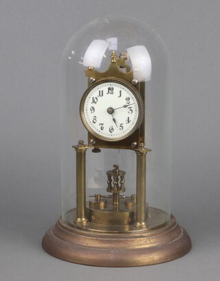 A 400 day clock with 7cm enamelled dial, contained a gilt case complete with dome 