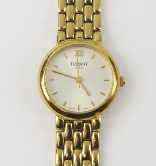 A lady's gilt cased Tissot quartz wristwatch on a gilt bracelet, contained in a 20mm case