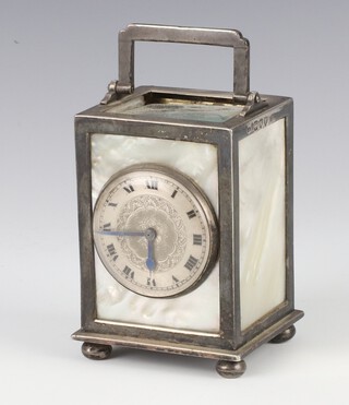 A Victorian silver mounted mother of pearl carriage timepiece on ball feet with engine turned dial, the back plate engraved with scrolls, London 1894, maker George Hammon, 10cm to handle 