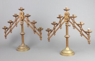 A pair of Victorian ecclesiastical gilt metal 7 light adjustable candelabrum marked with a cross, 148cm h x 49cm w 