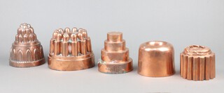 A circular copper jelly mould marked 226 12cm x 15cm, 1 other marked 242 9cm x 10cm together with 3 other jelly moulds 