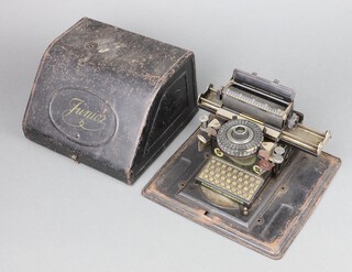 A  child's Junio typewriter in a metal case 12cm x 20cm x 20cm  