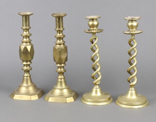 A pair of 19th Century brass candlesticks "The Diamond Prince" with ejectors 30cm h, a pair of brass spiral turned candlesticks 30cm h 