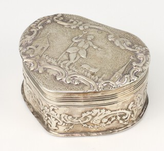 A Dutch repousse silver heart shaped box decorated with figures in farmyard scenes, import marks London 1903, 7cm, 82 grams 