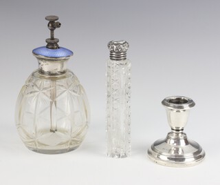 A silver dwarf candlestick Birmingham 1947, 6cm, a silver mounted scent bottle and an enamelled mounted atomiser (bruised)