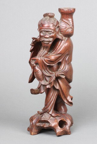 A Chinese carved hardwood figure of a standing fisherman 30cm 