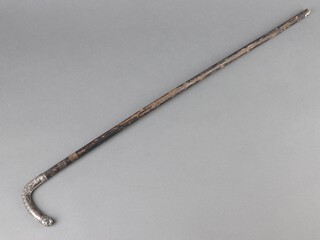 An Edwardian walking cane with white metal repousse handle with dogs hound head terminal (reduced in length) 63cm 