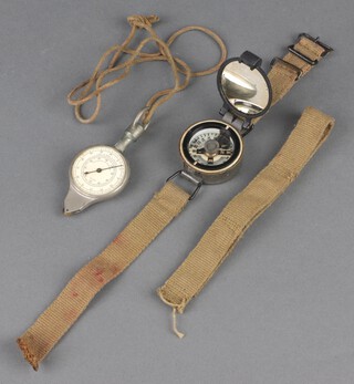 A British Special Forces military wrist compass marked REF No. 6B/2593 serial no. 01734B/57 ( likely F Barker and Sons ) together with a Continental compass and mileage counter  