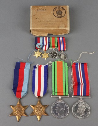 A group of 4 Second World War medals, attributable to P E Smith comprising 1939-45 Star, France and Germany Star, Defence and War medal together with miniatures  