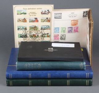 Two stock books of GB and world stamps, Victoria and later, a green album of used world stamps - Hungary, Finland, USSR, a Commando ditto  