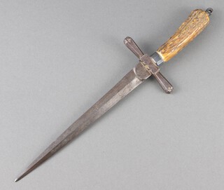 A 19th Century double bladed dagger with 17cm blade and horn grip