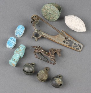 A Roman bronze ring and 2 Roman bronze brooches, together with other curios 