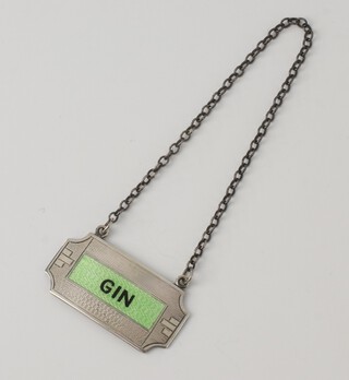 An Art Deco silver and guilloche enamel gin label, Birmingham 1938 