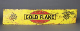 A rectangular yellow, black and red enamelled advertising sign, Wills's "Golden Flake Cigarettes" 39cm x 183cm  